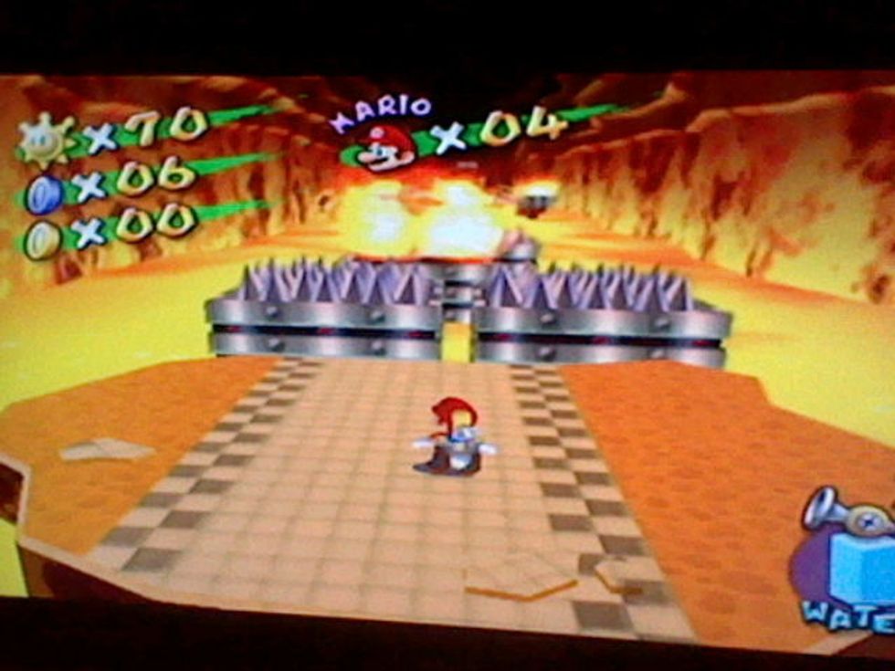 Once you are in the cave, you will see this. Use the hover nozzle to float over the spikes and fire.