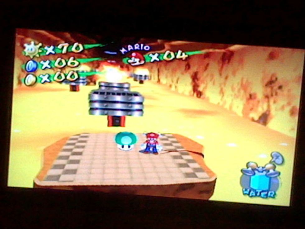 Once you arrive at the other side, pick up the green mushroom.