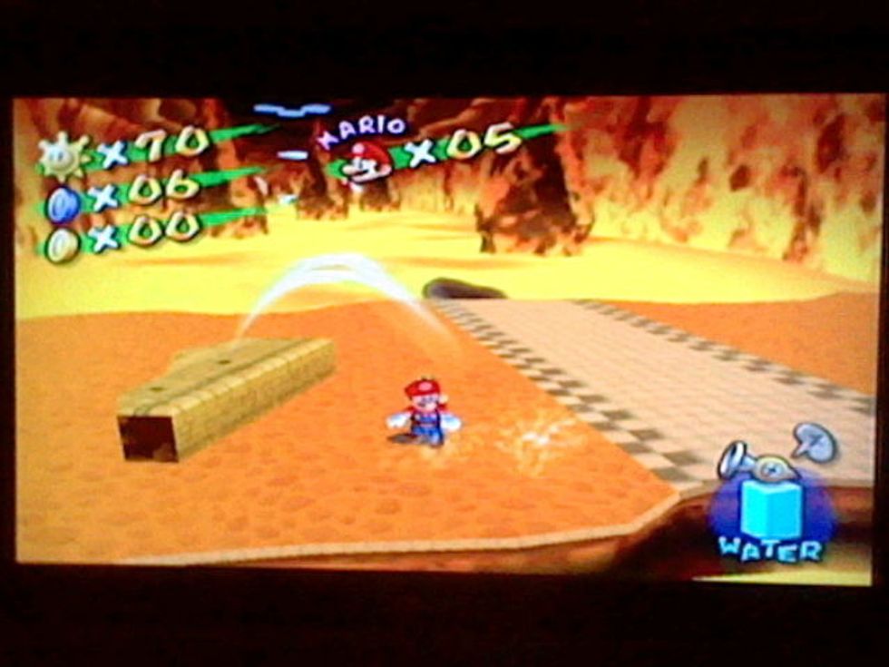 Once you arrive at the other side, there will be a sprinkler. Run into it to restore your water.