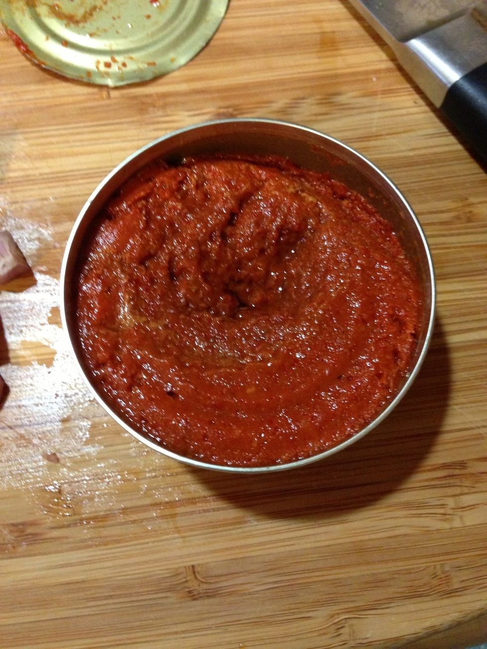 Once you begin to cook you'll need to move quickly. Prepare everything to be able to throw into the pan. Open the can of curry paste and it should look like this.