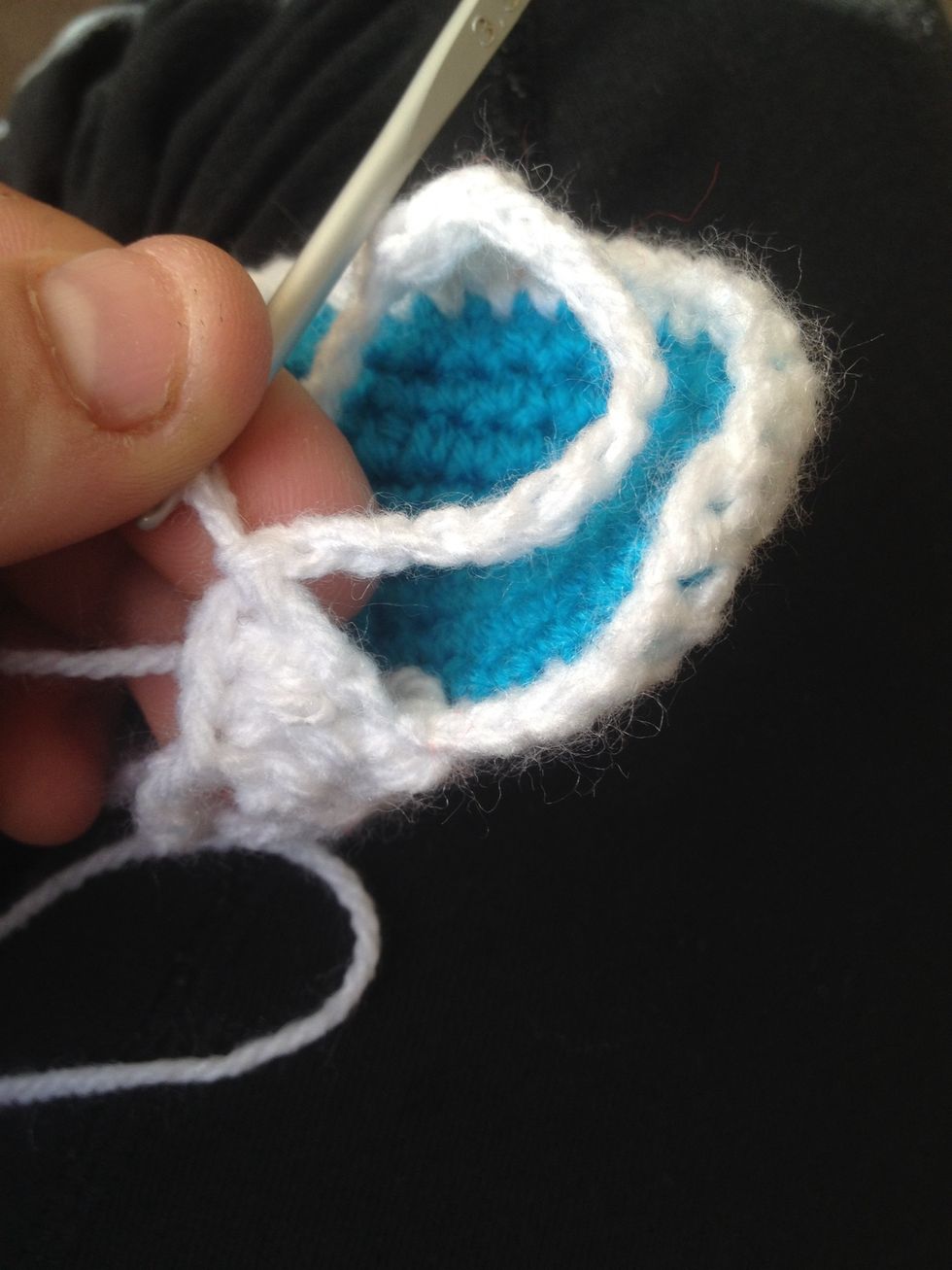 Once you chained 12 slip stitch it into the 1st stitch of the left strap.