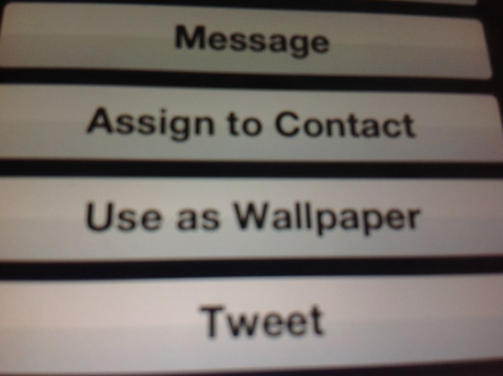 Once you click the arrow choose use as wallpaper. Then you will again be given the option to use as home screen, lock screen, or both.