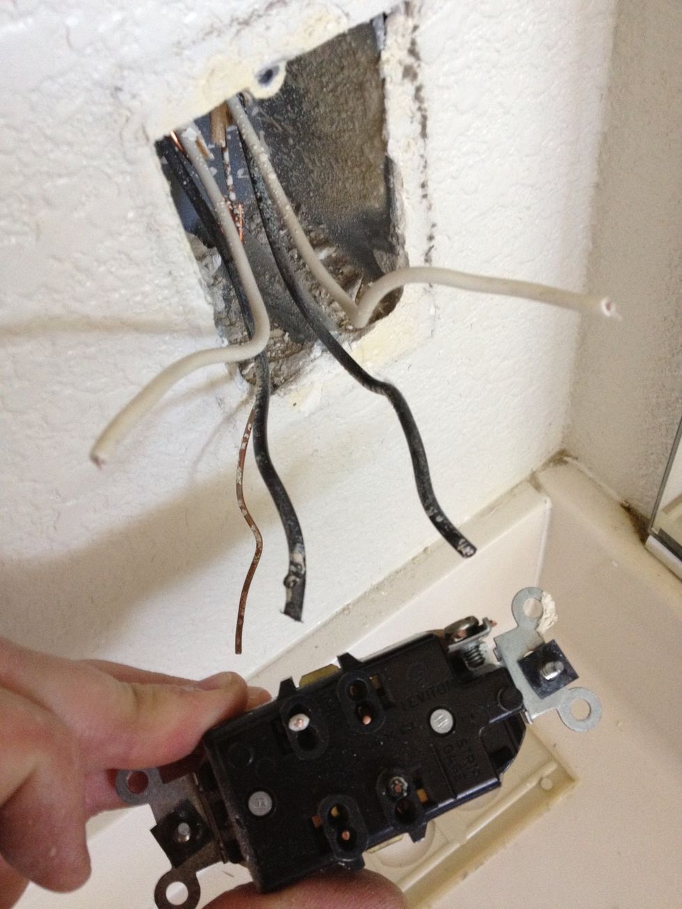Once you cut all the wires you can discard your old outlet. A "typical" outlet will only have 1 black, 1 white, and 1 bare ground wire. Since this one has more, it means it is part of a "series".