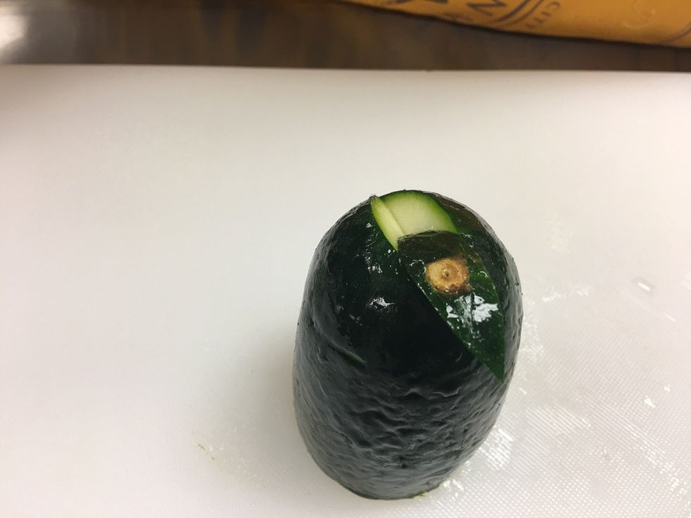 Once you cut it, cut it all the way out and slide it backwards just a little so that you can see the inside part of the Zucchini.