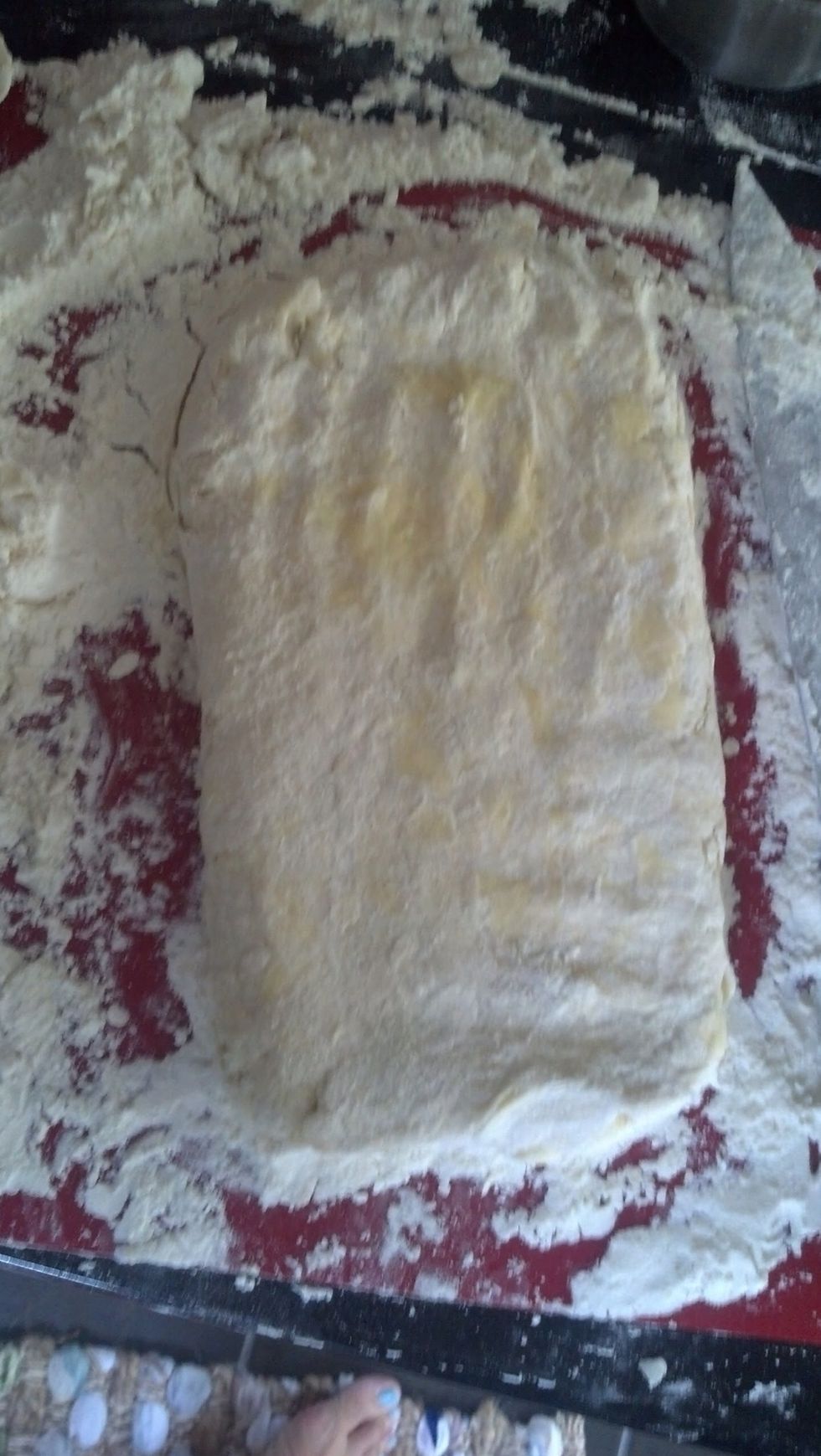 Once you do the first trifold, pat it again to compress the dough together more.  It might take another trifold til the dough holds together. When it looks like this, you are ready to cut.