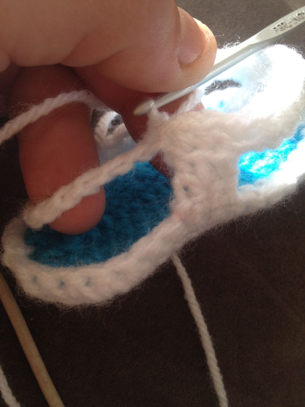 Once you done the 3 slip stitches on the strap we will do a single Crochet in each stitch of the back strap