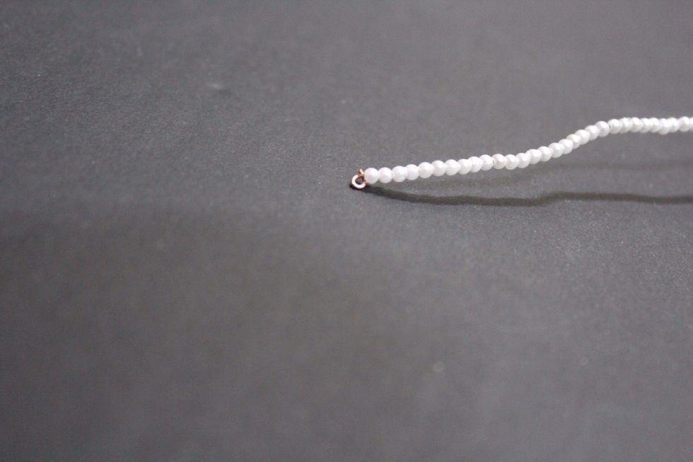 Once you finish adding the beads again bend it like this.