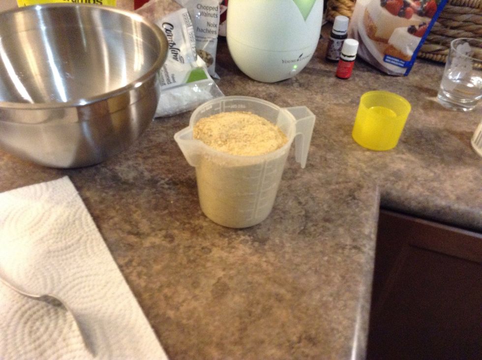 Once you finish spraying the pan measure the graham cracker crumbs