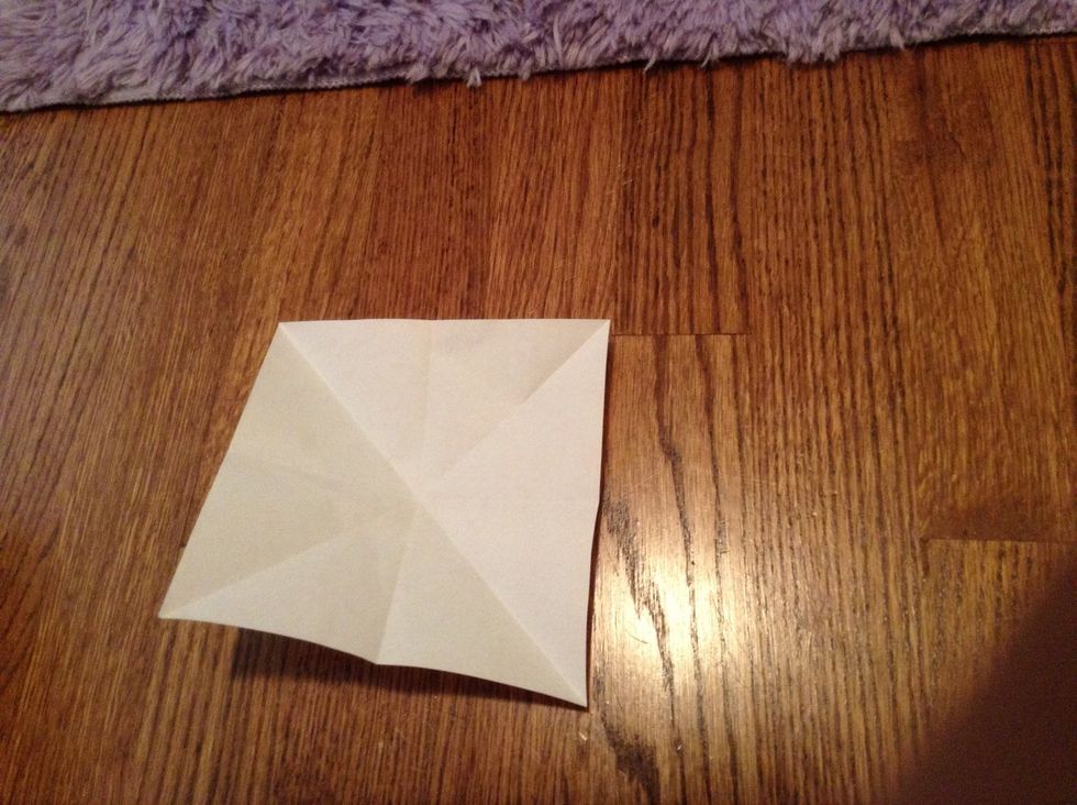 Once you fold diagonally both ways, it should create eight triangles.