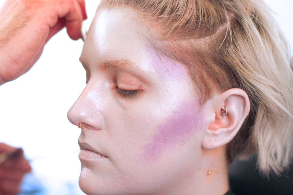 Once you get a nice unhealthy pallor, you\u2019re ready to do some contouring. Take a smaller brush and contour all the recesses of the face with light purple.