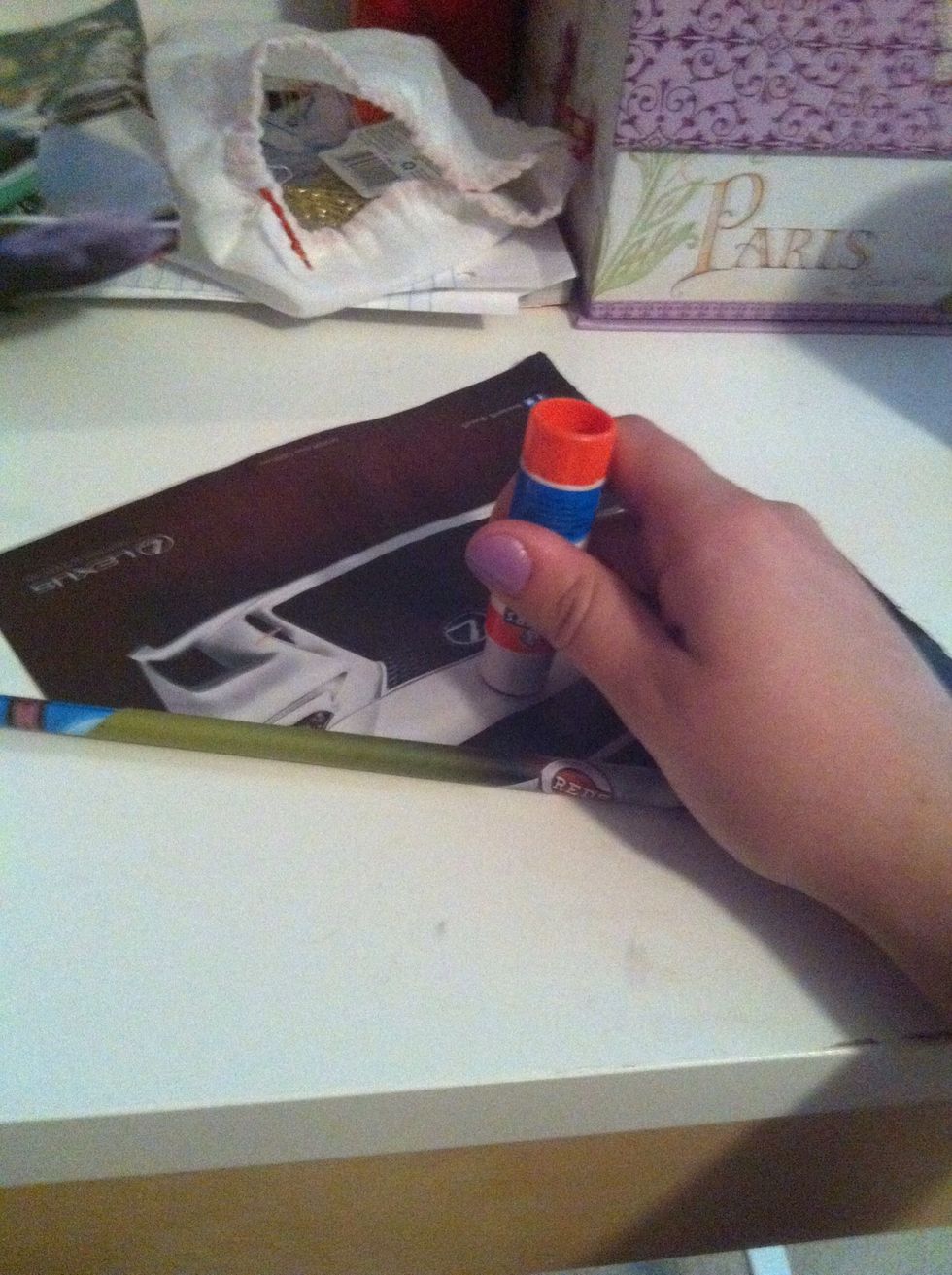 Once you get half way take your glue stick and glue the paper so it's nice and tight