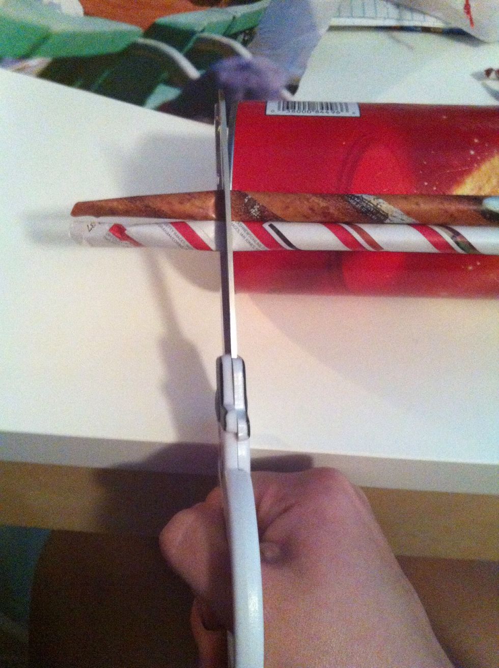 Once you get some glued on cut the excess paper off so it's nice and even! Keep glueing them on until you've covered the whole thing