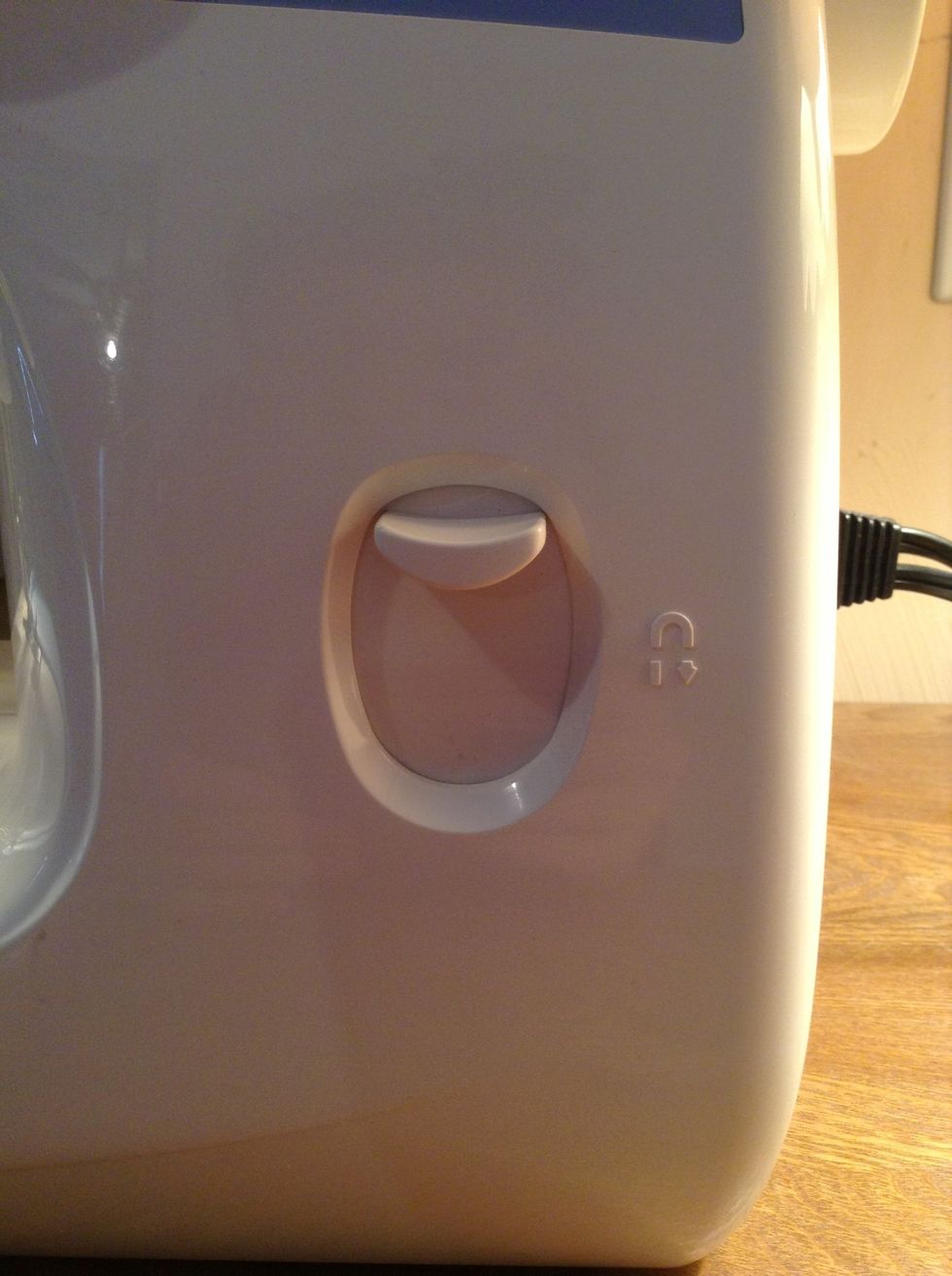 Once you go a little ways, press and hold down the button that makes the sewing go backwards.