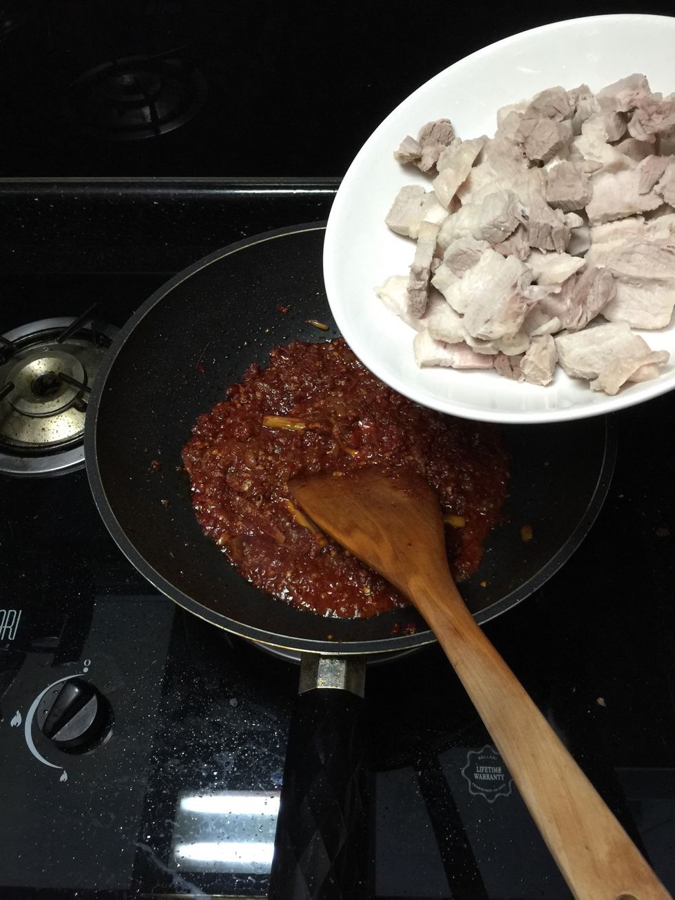 Once you happy with the taste of the paste, add the cooked meat.