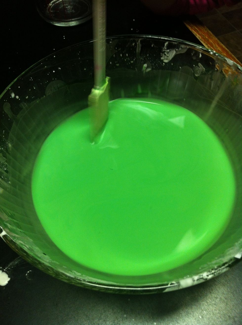 Once you have a dark colour you're satisfied with, pour it into a pan. Scrape as much out of the bowl as you can using the spatula.