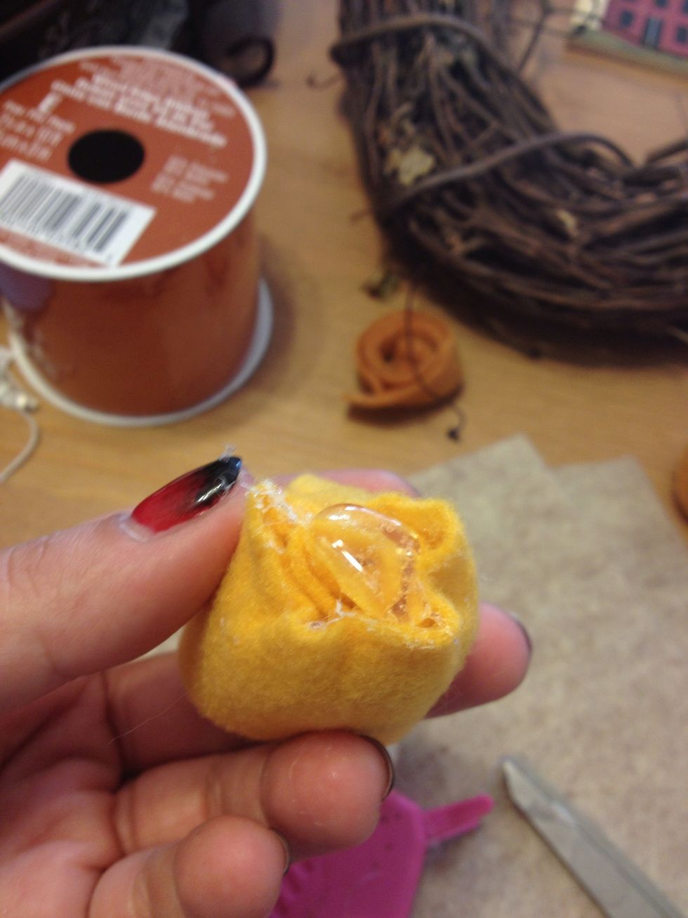 Once you have all the flowers you want start glueing into the wreath. Big glob of glue at the end of the flower...