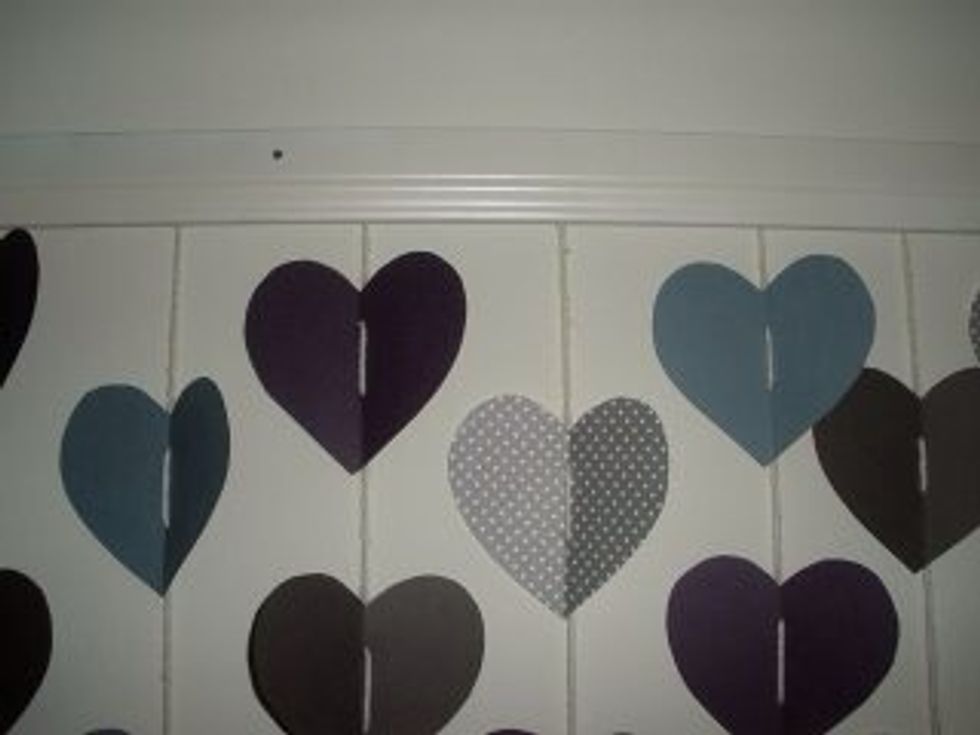 Once you have all your stands prepared, you can either tape them directly to the wall, or you can tape or hot glue them to a piece of plastic or wooden trim.