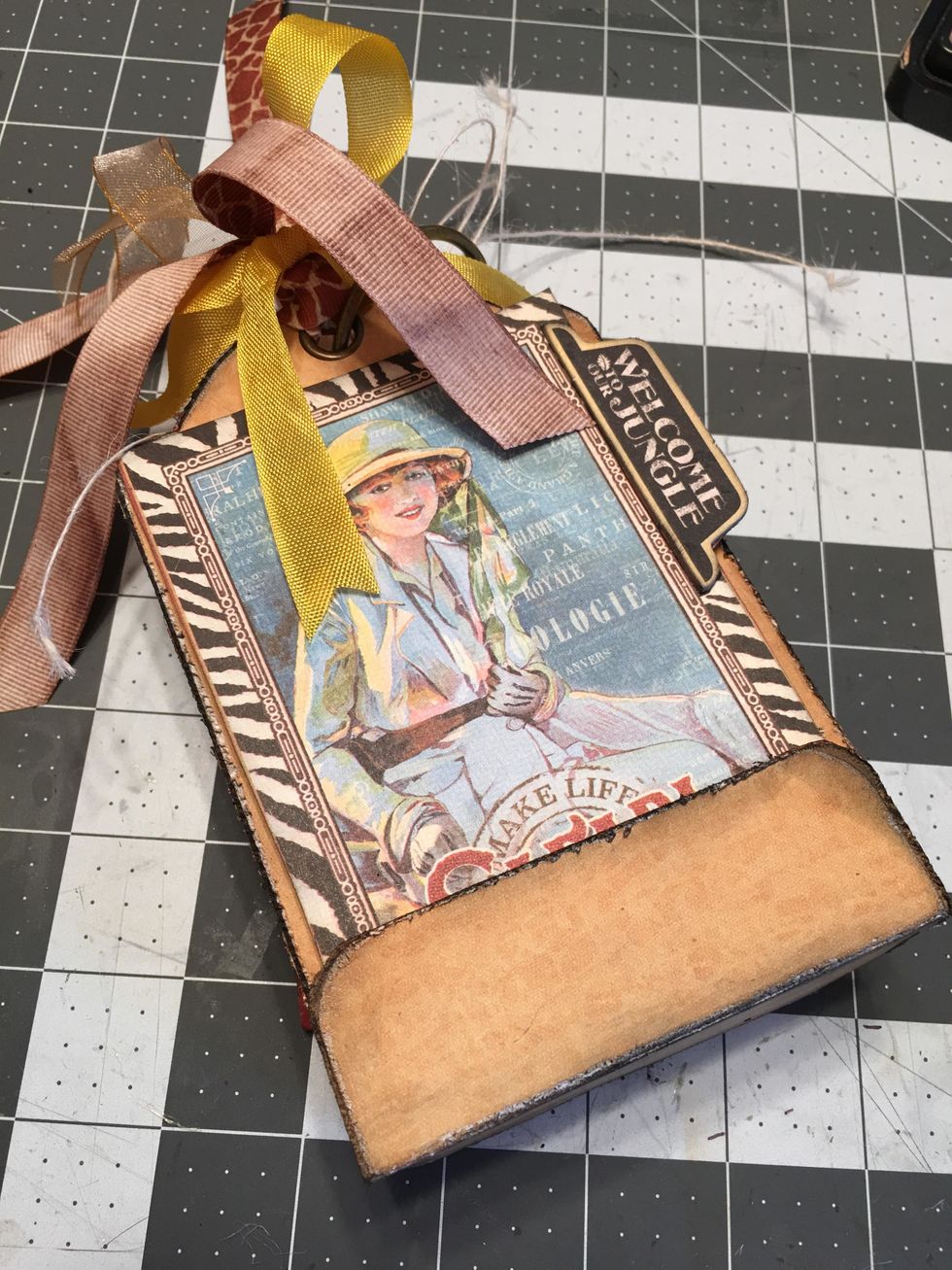 Once you have all your tags patterned and tied with ribbon, slide them on to the ring with the first tag on the top and the tag with the wrap section on the bottom.