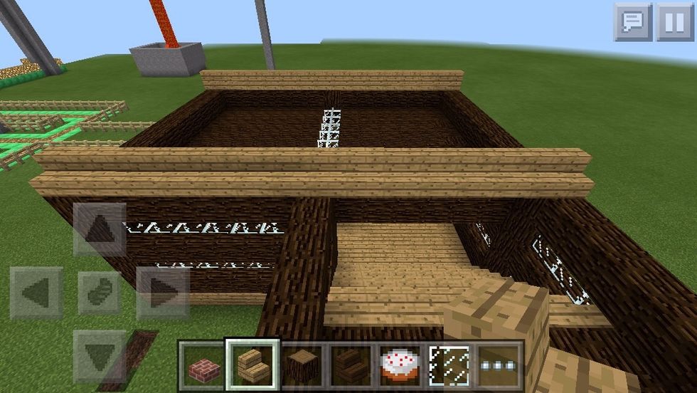 Once you have also made the spruce wood ceiling on the other rectangle, start the rooftop by using oak wood planks.