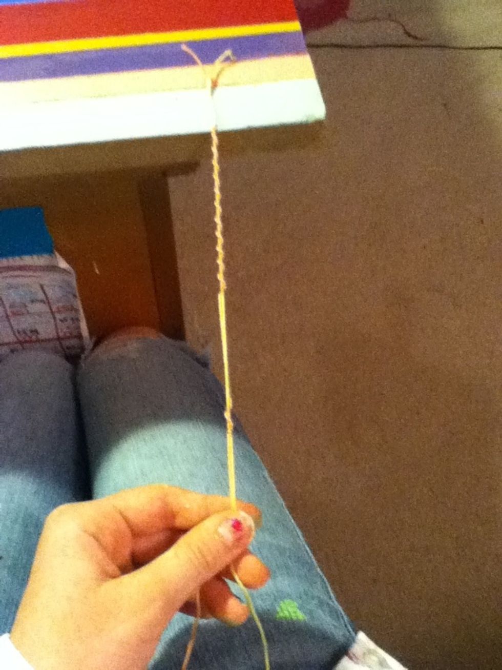 Once you have Chinese staircases it, stretch the sting down to the spot where the book ends. Then leaving all that string open do five more stitches to hold them together, knot and cut. Now your done!