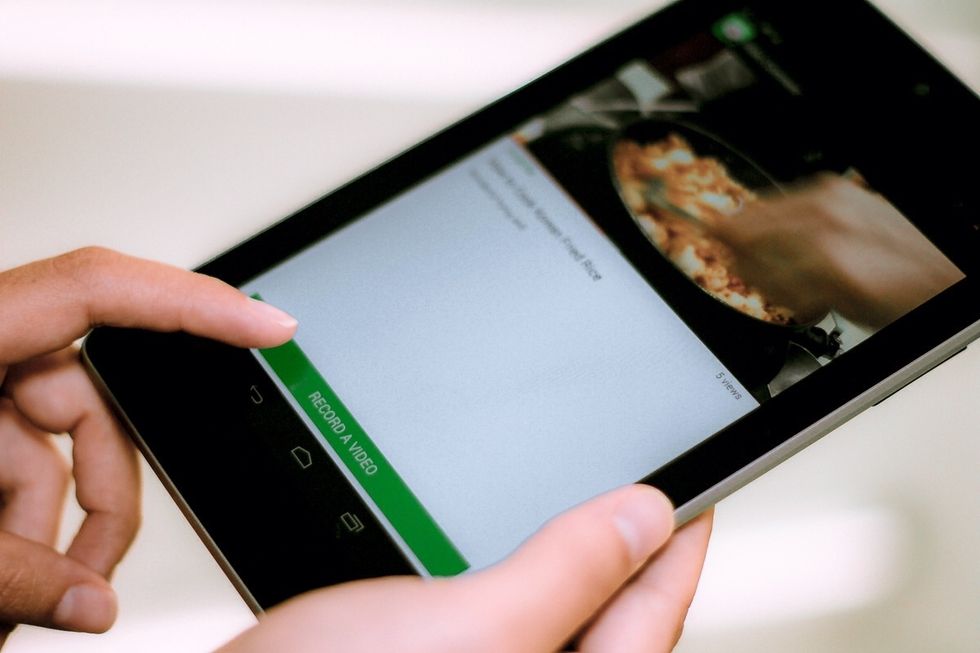 Once you have chosen the YouTube video, preview it. To add yourself to that video, tap the "RECORD A VIDEO" button.