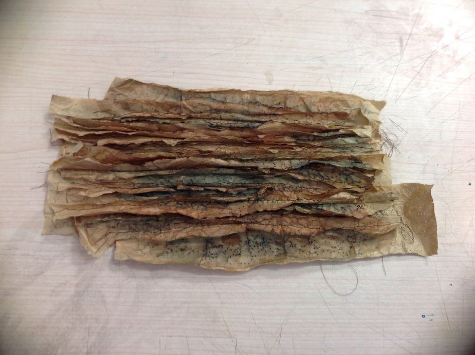 Once you have cut and separate the layers add a dark brown and black dye or water colour to the separated areas and dry