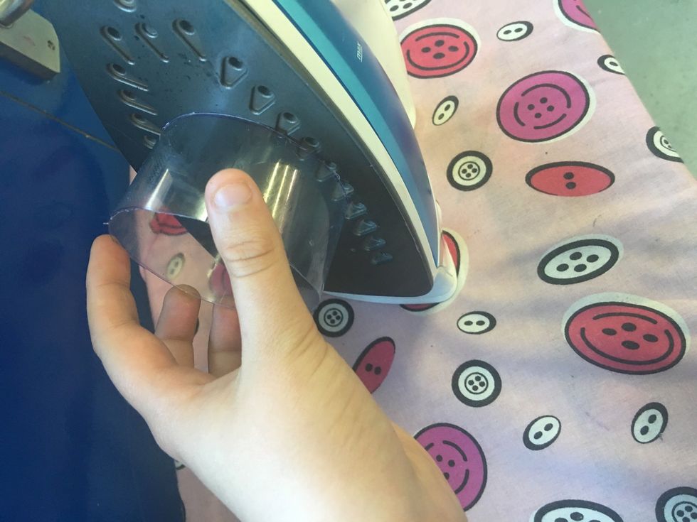 Once you have cut the bottle, smooth it on the iron in a circular motion.
