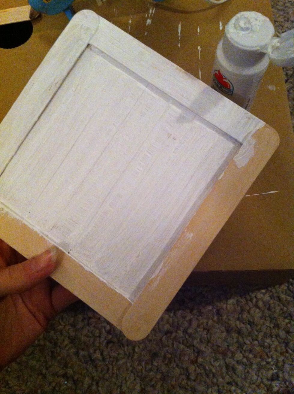 Once you have finished placing and gluing the sticks, flip it over and begin to paint it. You can use what ever color you would like. I chose white.