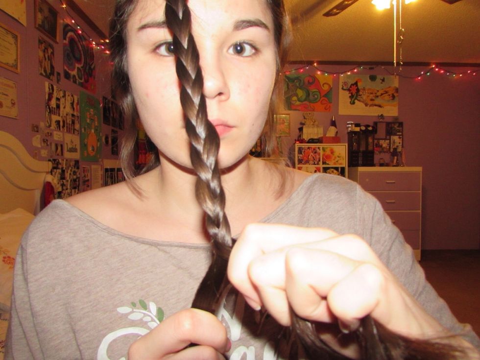 Once you have gotten down to the end where you can no longer braid anymore, hold two strands in one hand and one strand in the other.