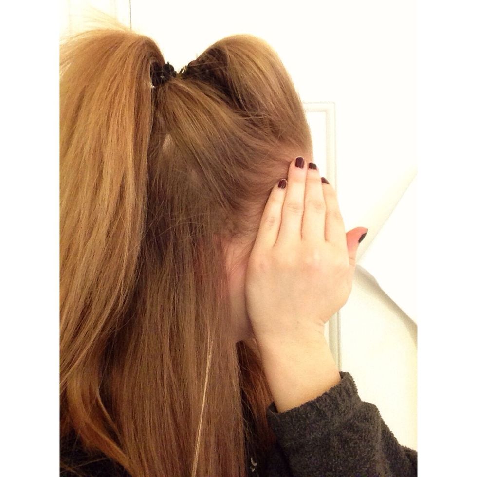 Once you have gotten the hair for your ponytail where you want it on your head, wrap a ponytail holder around the hair.