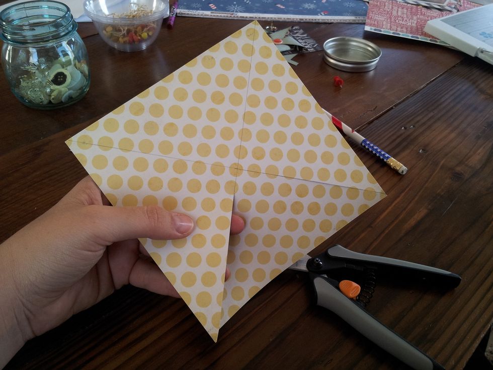 Once you have made the X, cut up the lines to about 1/2" from the center. Do this on all sides.