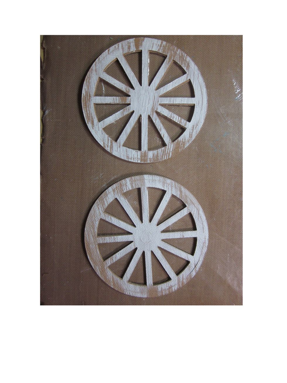 Once you have made two wheels, lightly brush them with the sponge brush and paint like you did on the main box.  Again we are looking for a distressed paint look.