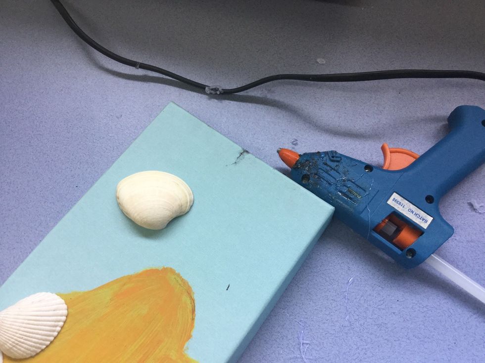 Once you have sorted your supplies, it is time to decorate! Before using a hot glue gun to stick the shells down, place them were you want to put them, so that the glue doesn't dry straight away.