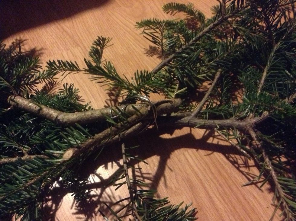 Once You have two piles of similar size trimmings Cut a piece of wire  and wrap the branches together. Use a thick wire