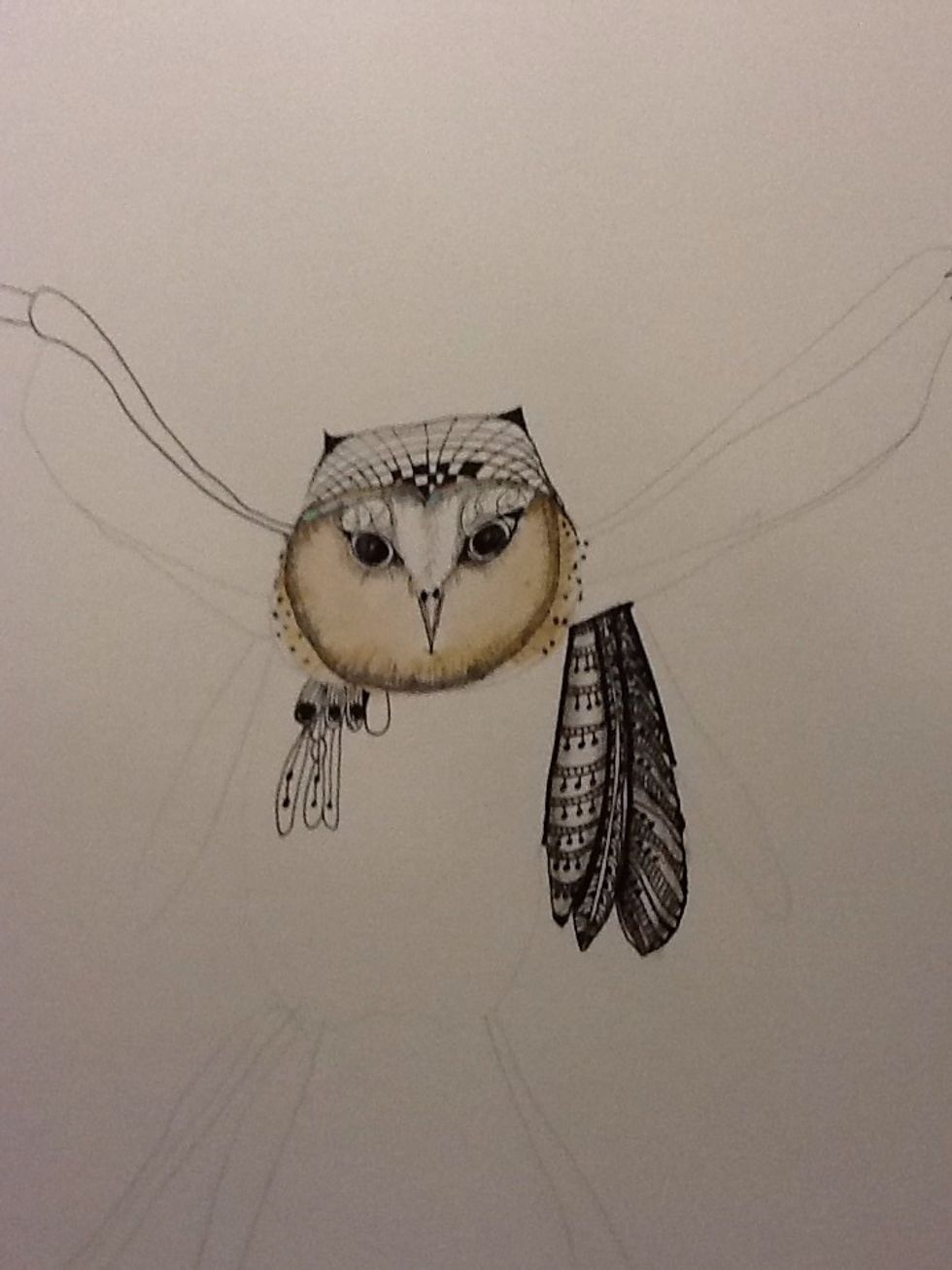 Once you have your basic bird shape you can start drawing the wings and feathers. I've used a whimsical combination of zentangle and drawing.