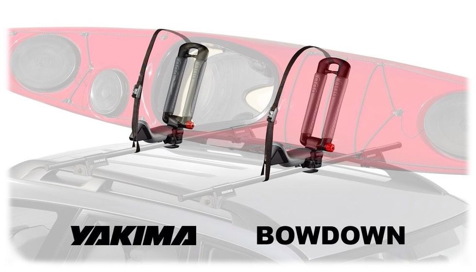 Once you have your boat loaded in the cradles bring the straps under the crossbar and up through the tower.  Insert the straps through the buckle and tighten down.