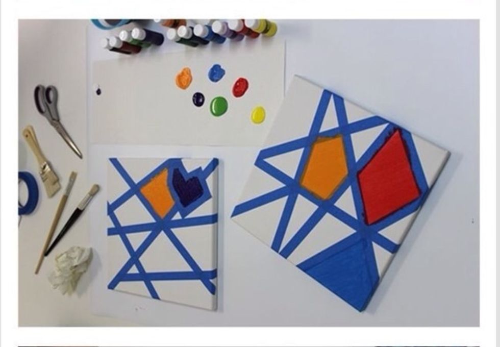 Once you have your tape on your canvas, start painting sections each a different color. Do NOT try to put two colors in one section. Do this until they are all filled.