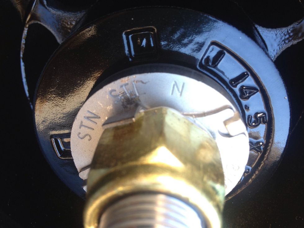Once you know the clearance is ok, bend the ends of the lock washer up to the sides of the nut