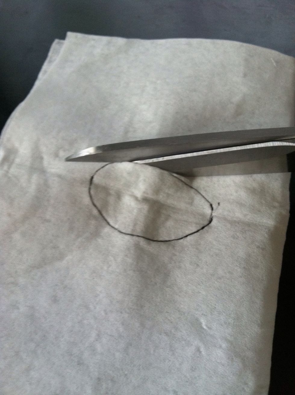 Once you made a small cut, you can open it up and cut the rest.