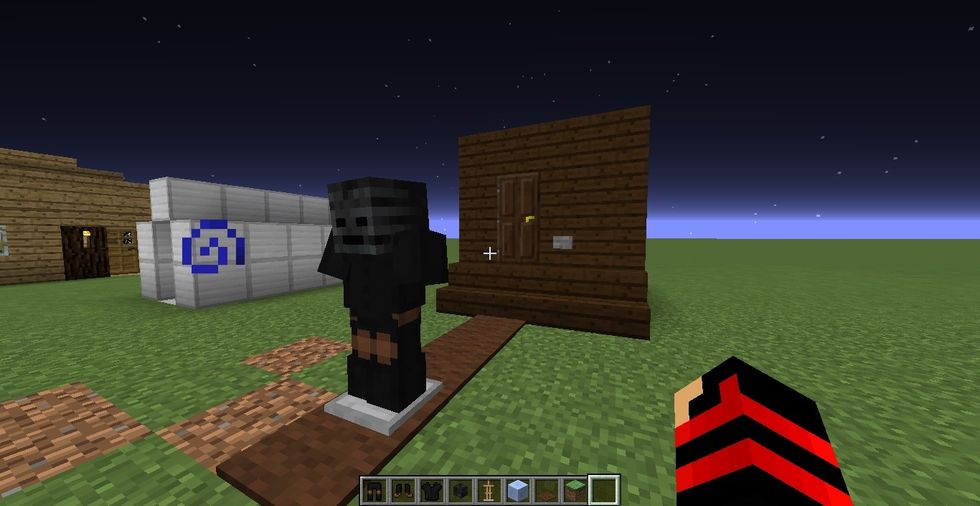 once you press button, this armor stand will pop out from the door. to re-use it, you need to break armor stand that already got out and then just place back in the door where it was.