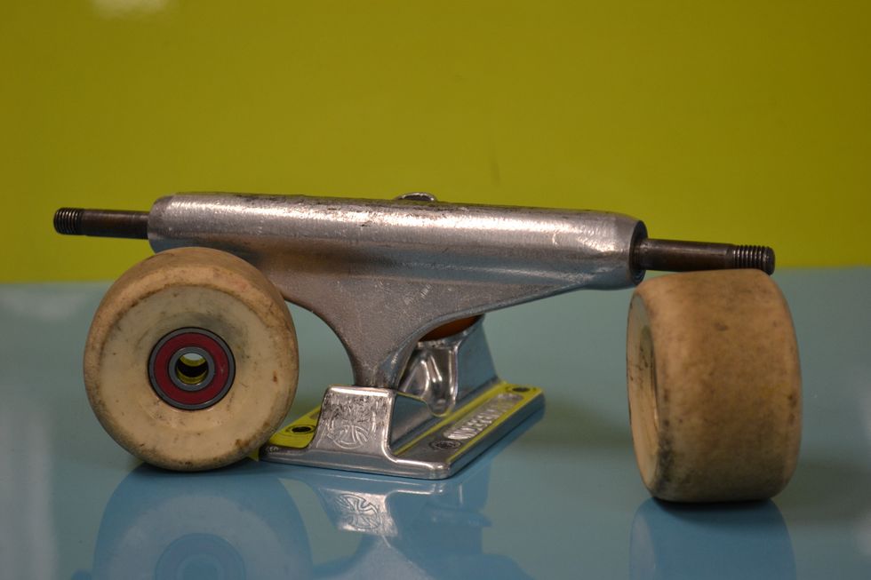 Once you put all the bearings in the wheels, you place the wheels on the trucks.