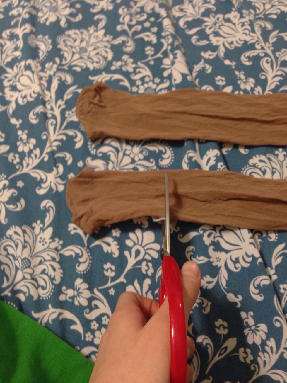 Once you're ready, cut the tights at around the ankle area. (It depends if you want it long sleeve or short. If you want it shorter, go for the knee area and continue from there.)