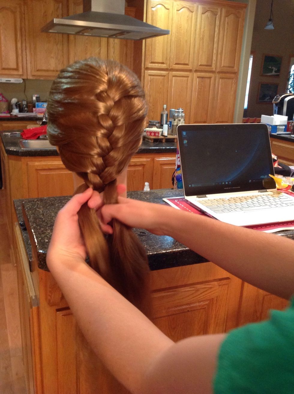 Once you reach the bottom of the braid, finish the braid by continuing to move the outside pieces inward but without adding new pieces.