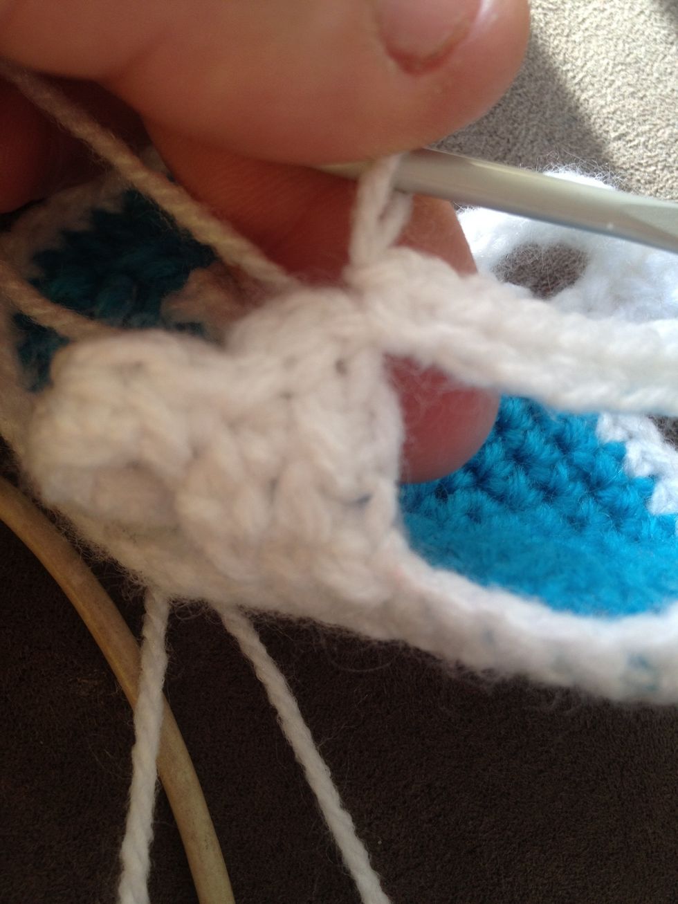 Once you reach the left side of the strap slip stitch it into the first stitch.