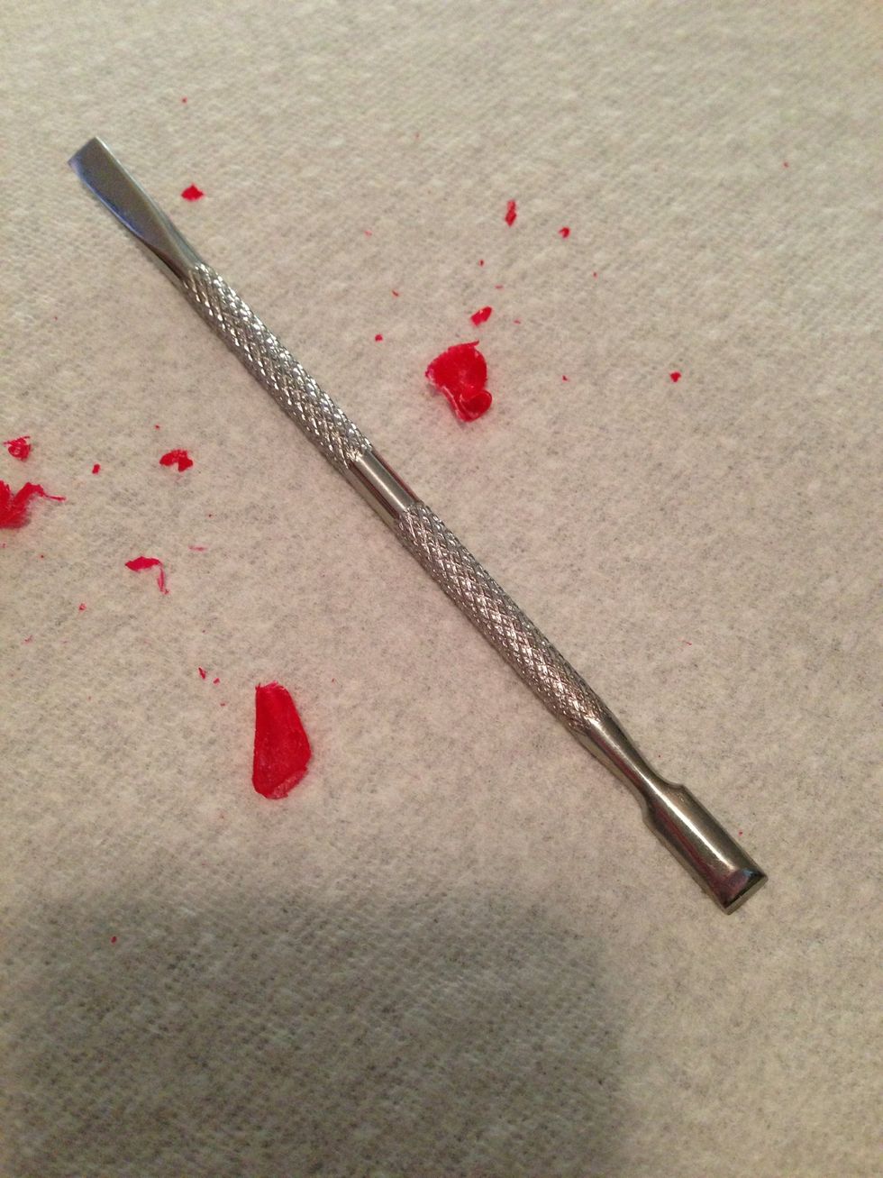 Once you take of the tinfoil, the edges of the polish will be lifting and then you can use the cuticle pusher to push the polish off