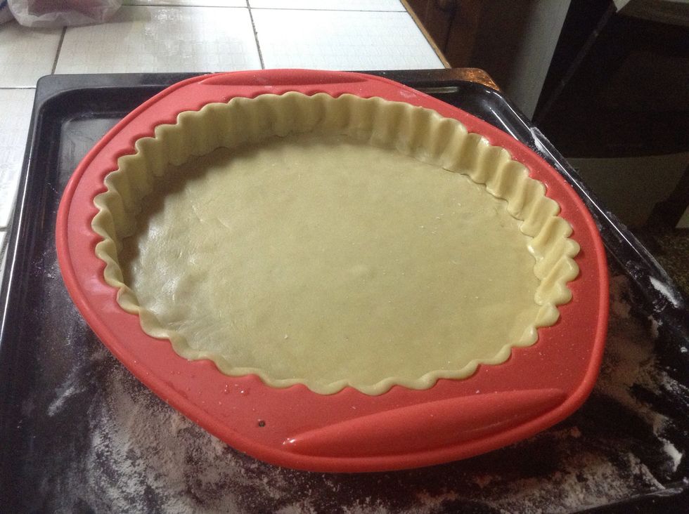 Once you take the wrap out, with the use of a brush paint the dough with egg whites and take it to the oven.