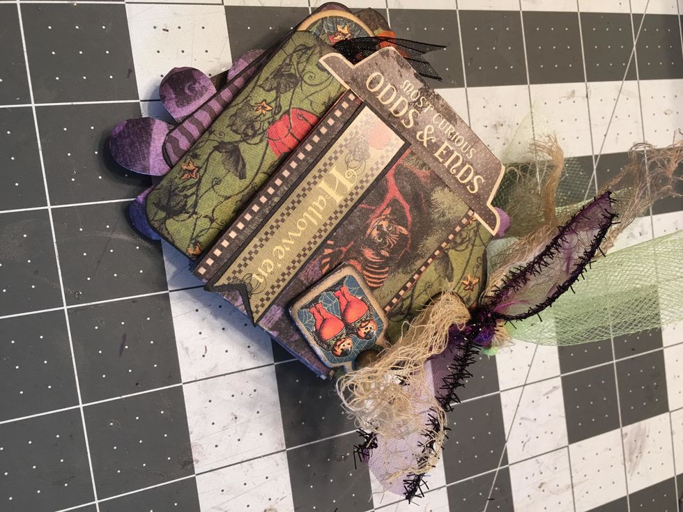 Once you've added all your tags and "pages" tie ribbons, tulle and stained cheese cloth to the ring of the album.