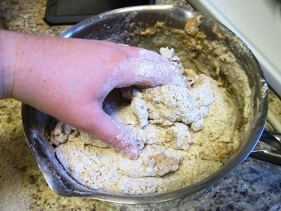 Once you've added the extra flour, it's time to start mixing by hand.
