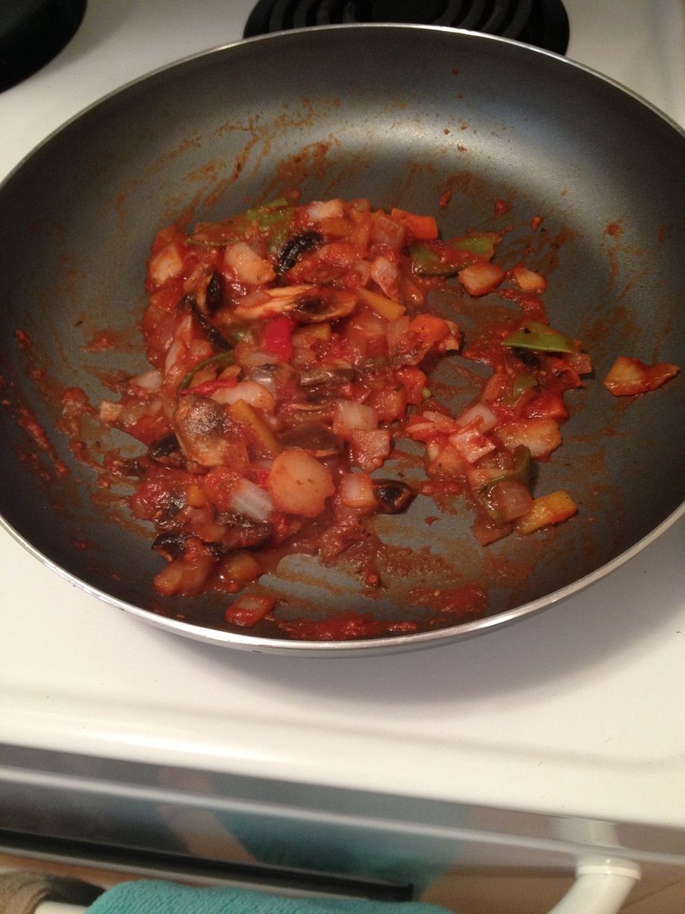 Once you've cooked the veggies together, coat with the pasta sauce and place I low heat.