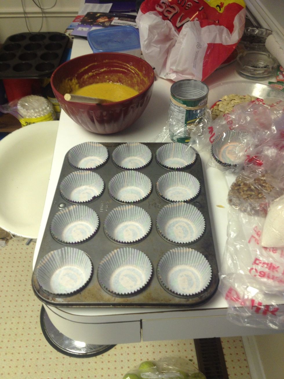 Once you've created a mix of the filling from the link on the previous step, you need to prepare your muffin tin. Muffin liners are adorable.